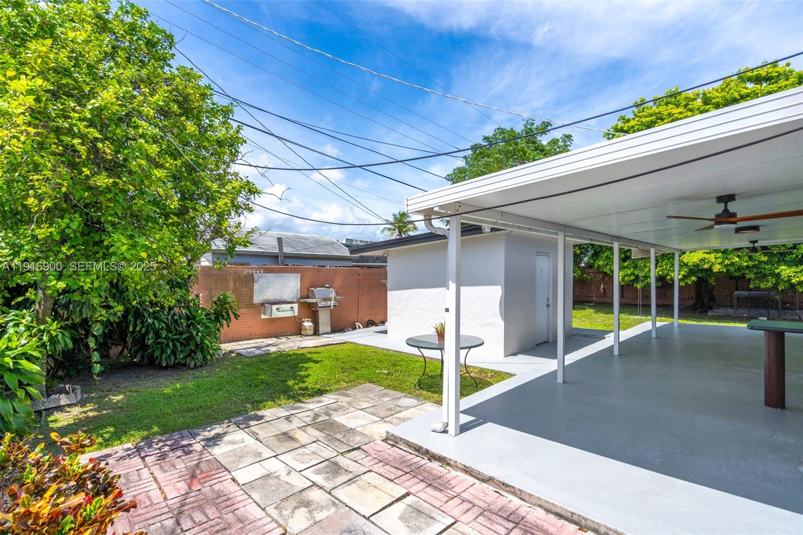 11030 Southwest 42nd Street Miami, FL 33165 - Photo 26 of 34 a view of a house with backyard and porch