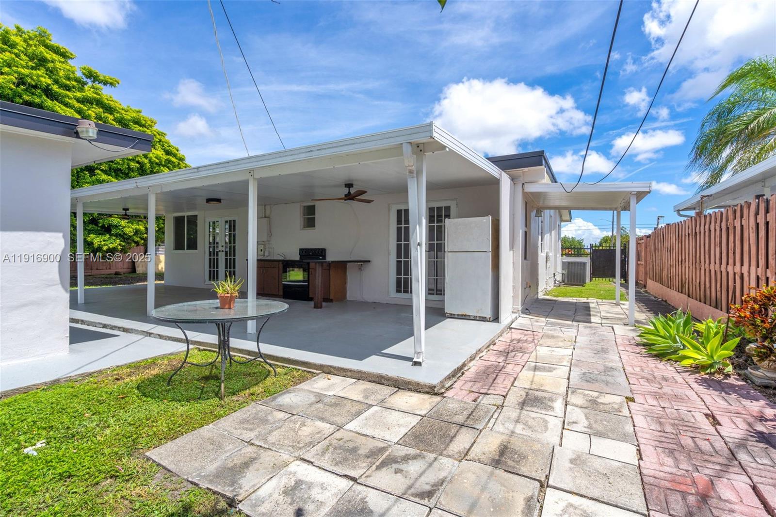 11030 Southwest 42nd Street Miami, FL 33165 - Photo 27 of 34 a view of a porch with chairs and potted plants