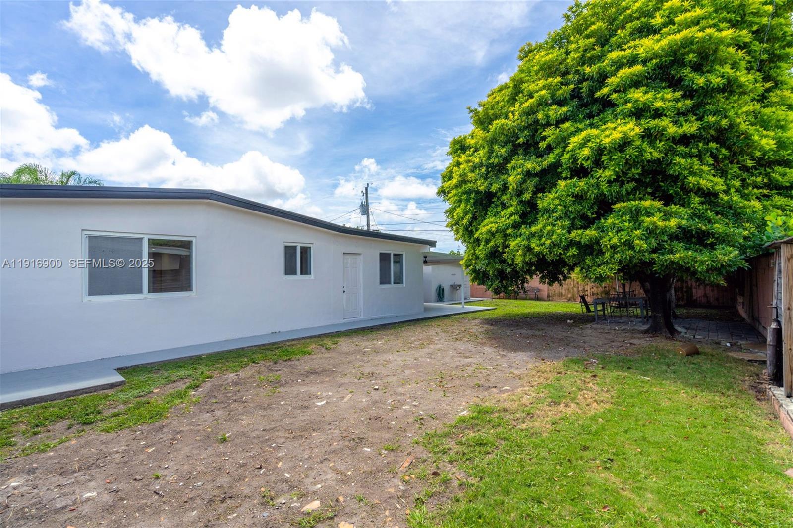 11030 Southwest 42nd Street Miami, FL 33165 - Photo 28 of 34 a view of a house with a backyard