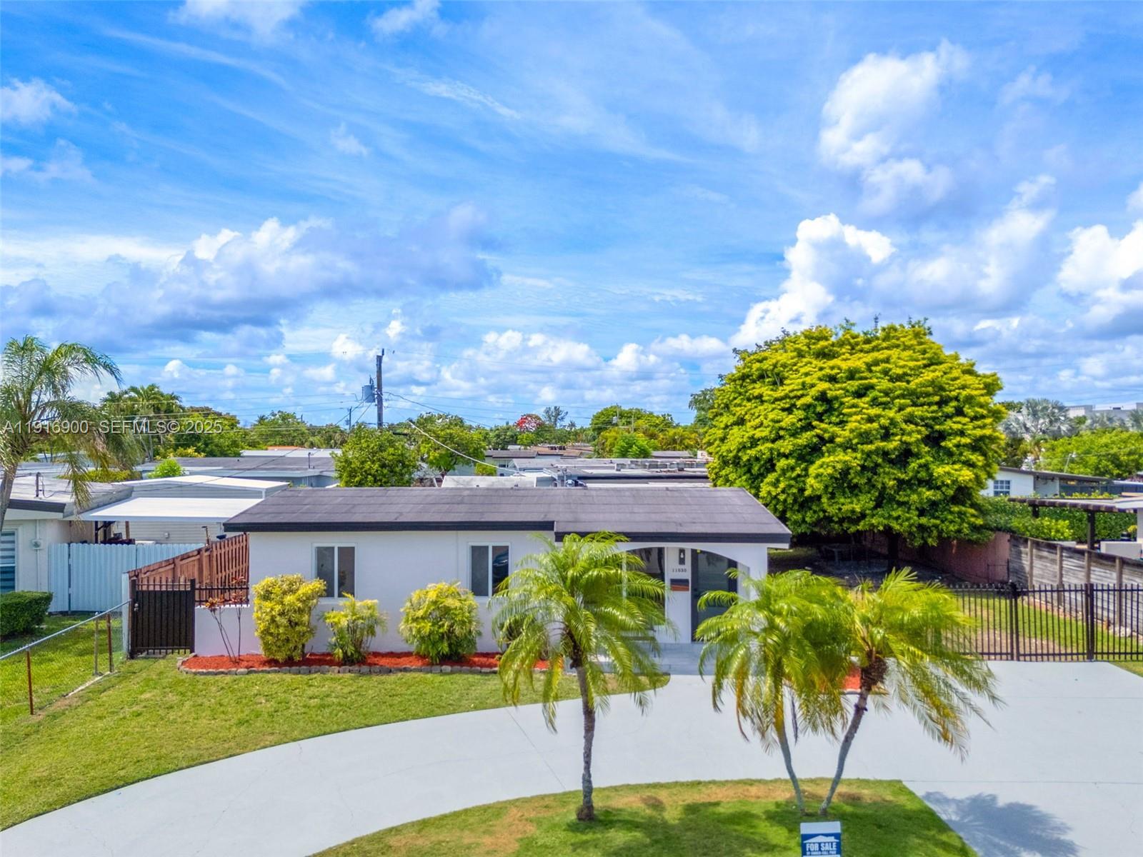 11030 Southwest 42nd Street Miami, FL 33165 - Photo 29 of 34 a view of a house with a yard