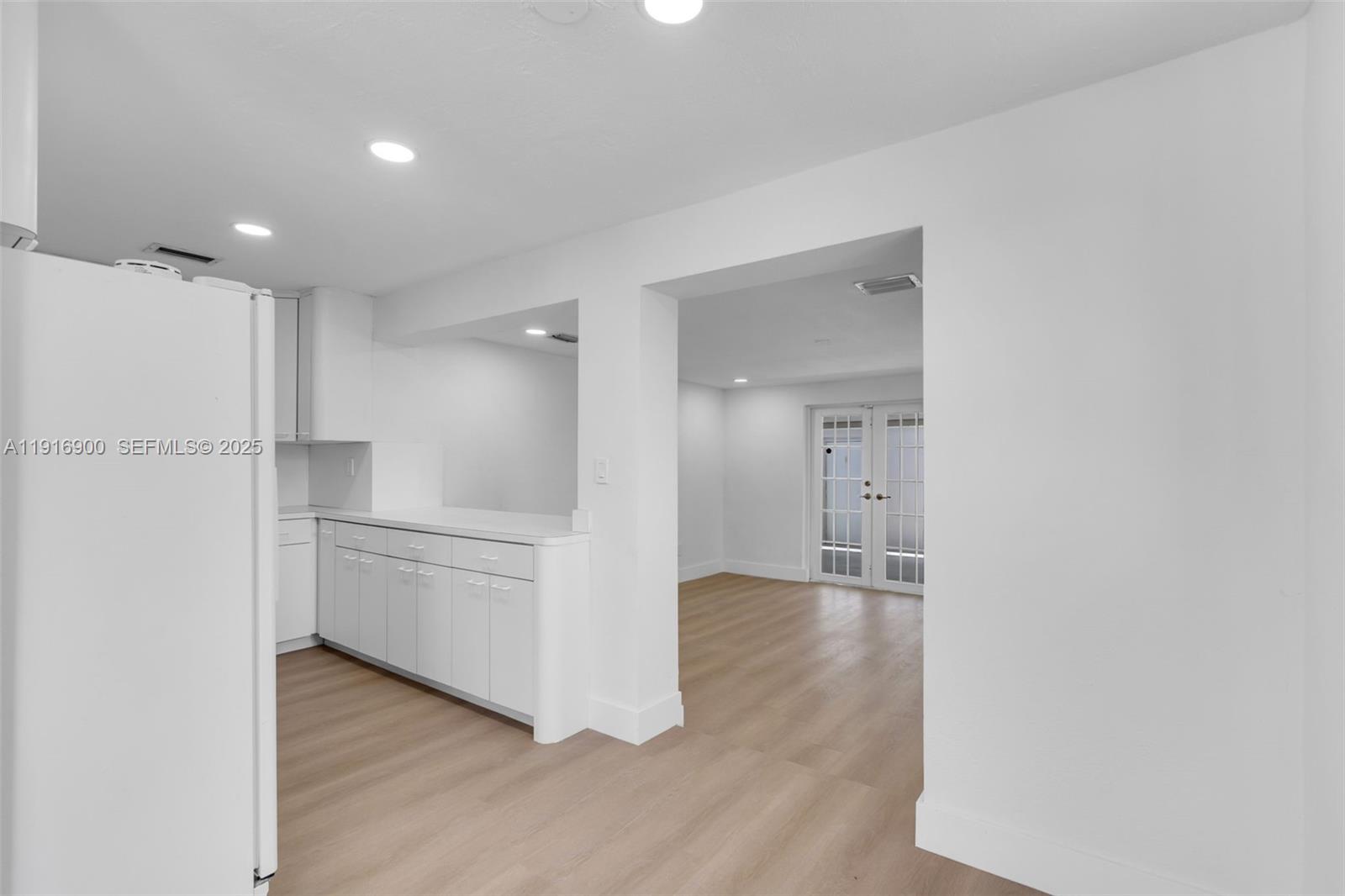 11030 Southwest 42nd Street Miami, FL 33165 - Photo 7 of 34 a view of a kitchen with a refrigerator and a sink