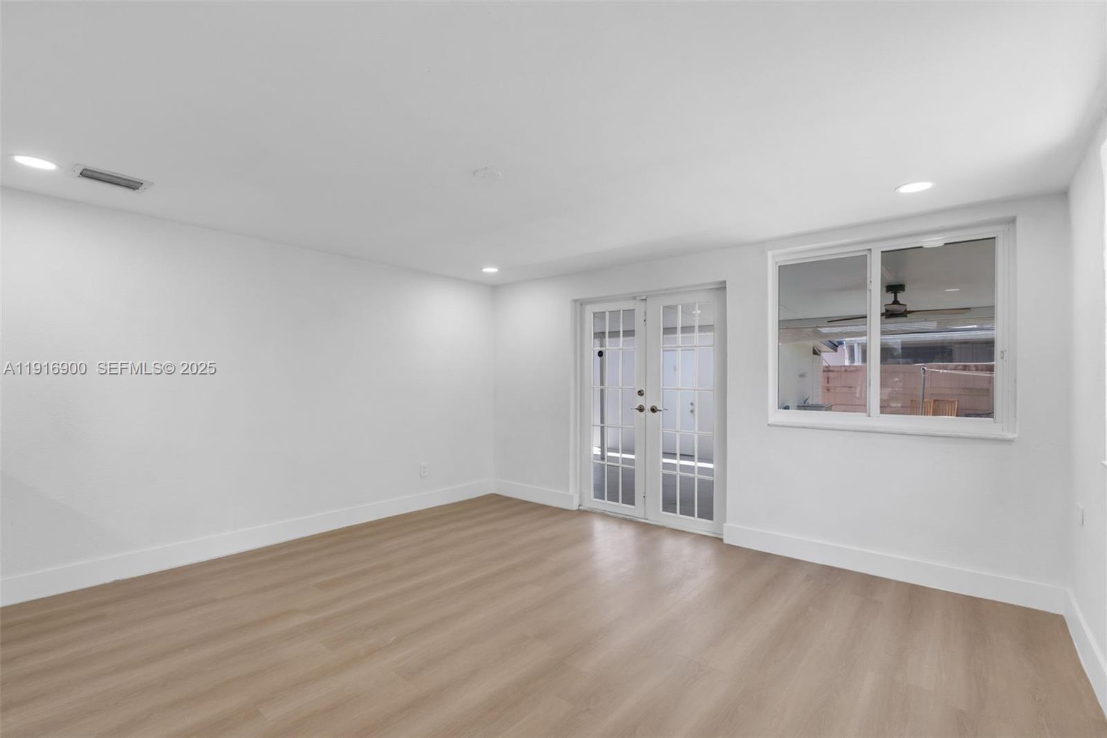 11030 Southwest 42nd Street Miami, FL 33165 - Photo 10 of 34 a view of an empty room with a window