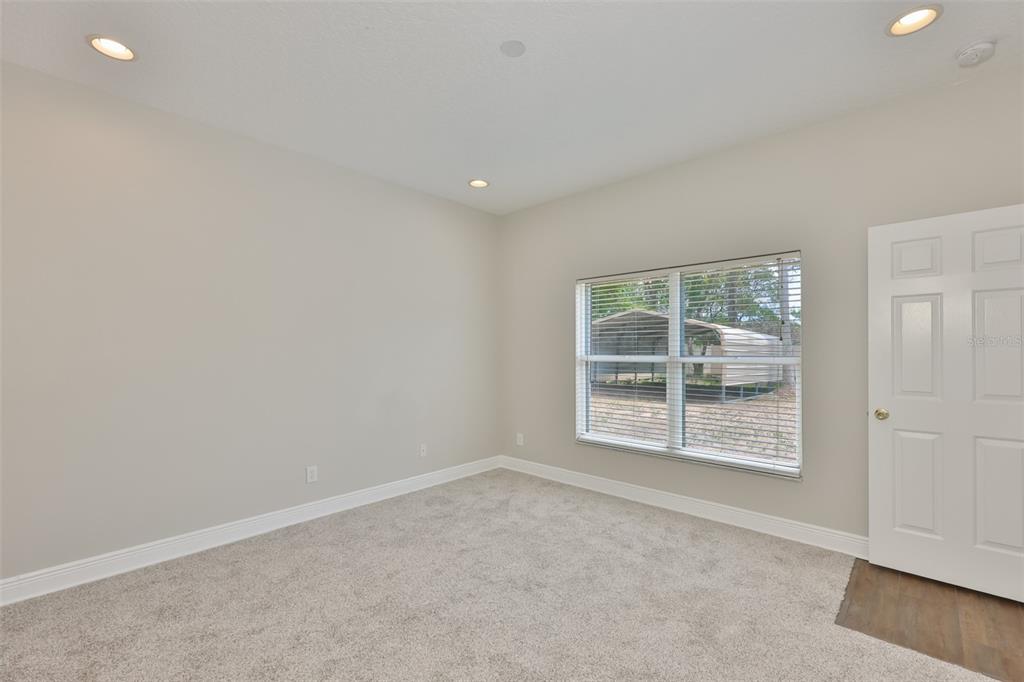 708 Coade Stone Drive Seffner, FL 33584 - Photo 28 of 48 an empty room with windows