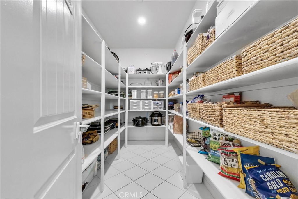 37656 Needlegrass Road Murrieta, CA 92563 - Photo 11 of 29 The envy of every chef, this huge pantry it where everything else goes.