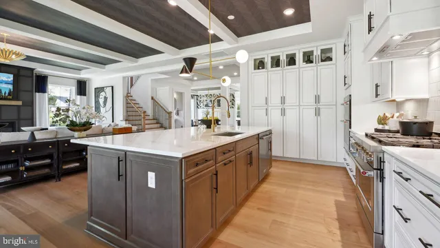 a kitchen with a table chairs refrigerator and cabinets