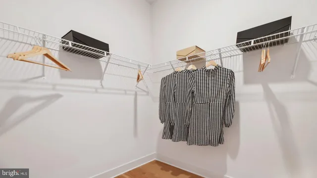 a kitchen with a dining table chairs and a coffee table