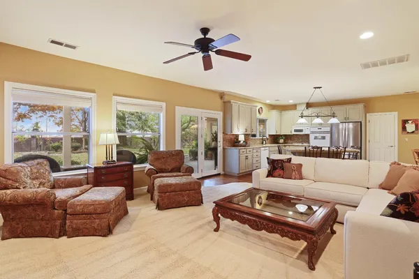 a living room with furniture or couches and a large window
