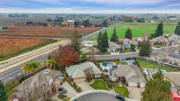 an aerial view of a house with outdoor space