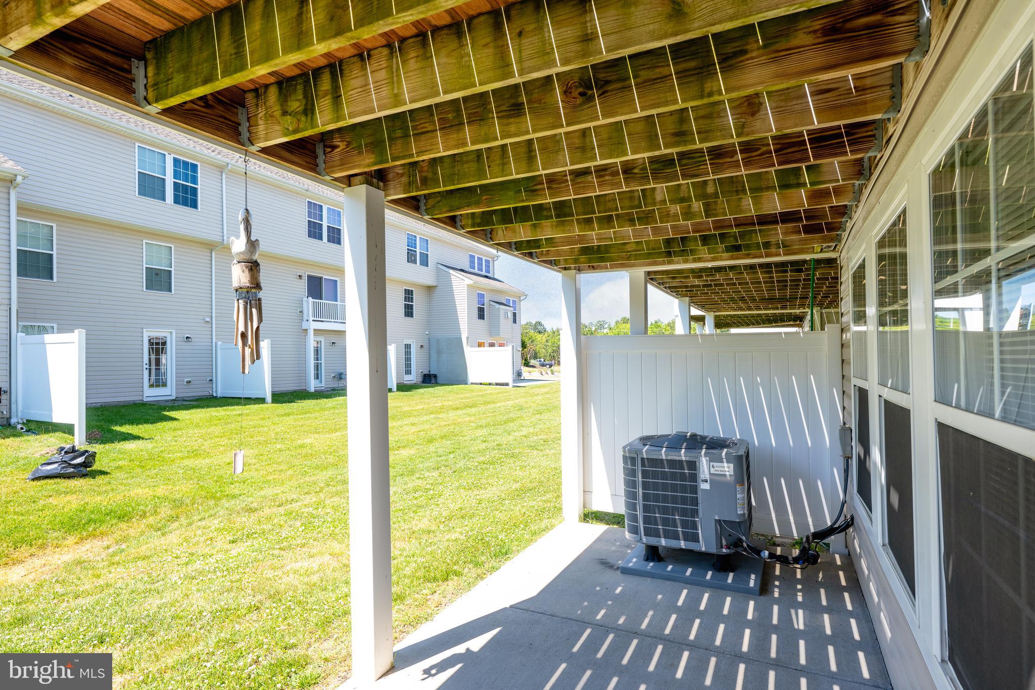 27548 Mayfield Road, Unit 42 Millsboro, DE 19966 - Photo 39 of 46 a view of a swimming pool with a patio
