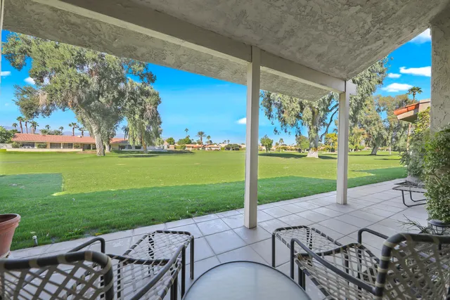 a view of a patio with a yard