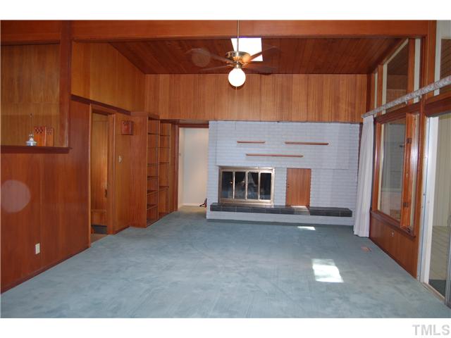1428 Canterbury Road Raleigh, NC 27608 - Photo 3 of 12 a view of a livingroom with a fireplace