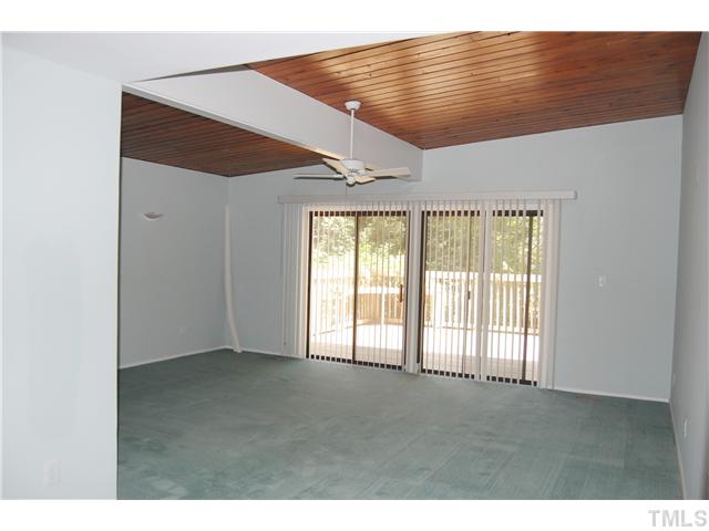 1428 Canterbury Road Raleigh, NC 27608 - Photo 5 of 12 a view of an empty room with a window