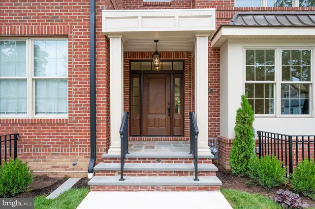 a front view of a house with a porch