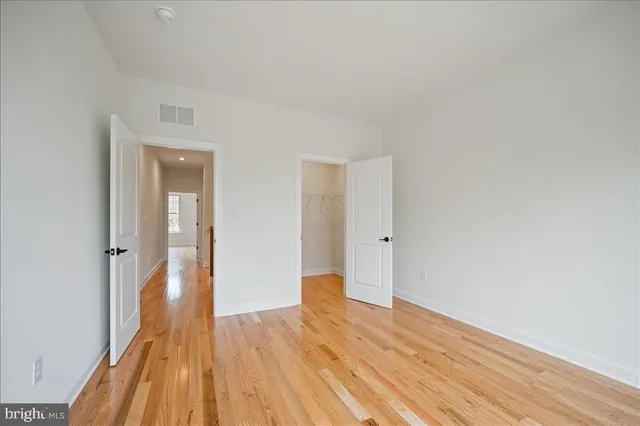 a view of wooden floor in an empty room
