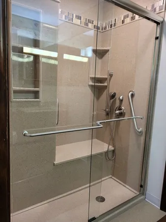 a bathroom with a sink vanity mirror and toilet