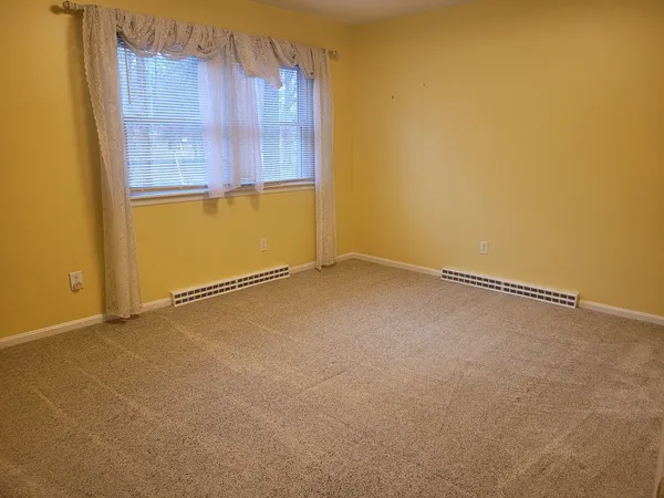 an empty room with closet area