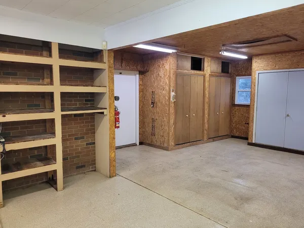 a view of an empty room with a closet