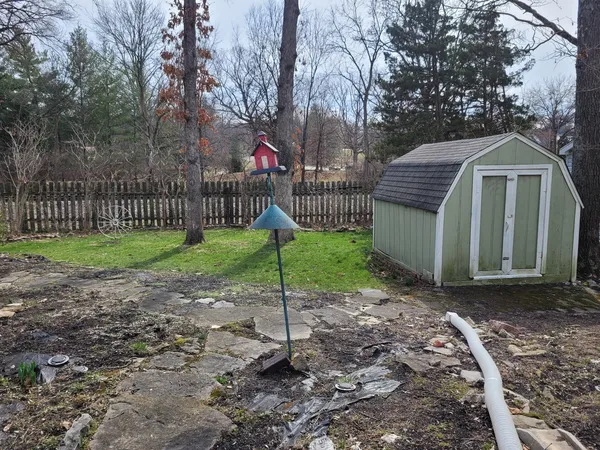 a view of outdoor space with garden and trees