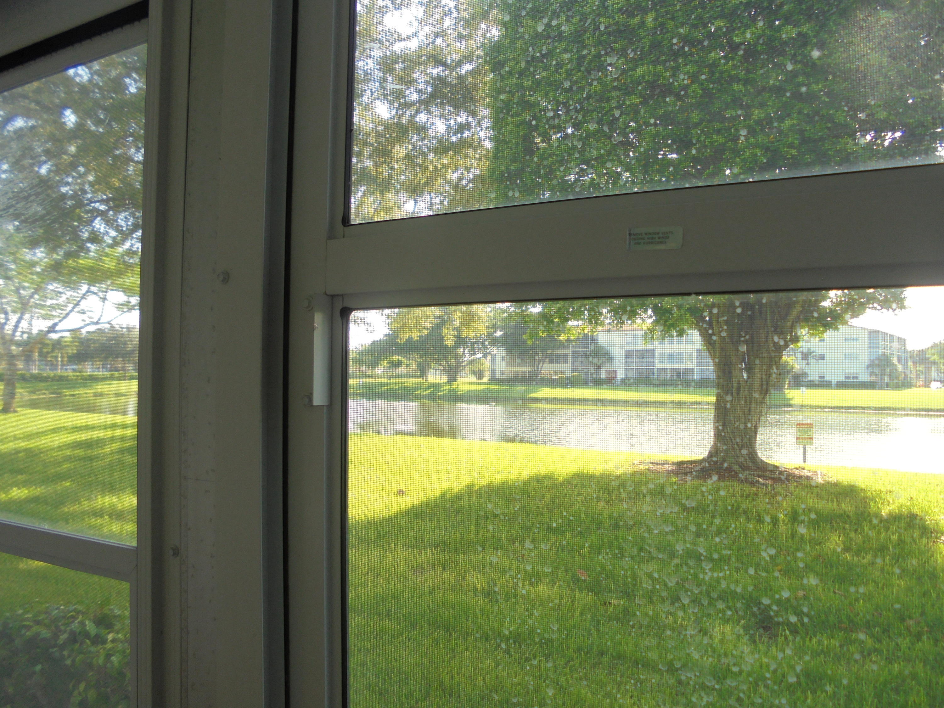 14 Brighton A Boca Raton, FL 33434 - Photo 1 of 15 a view of a water fountain and a yard from a balcony