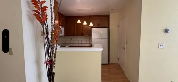 a view of a hallway with washer and dryer