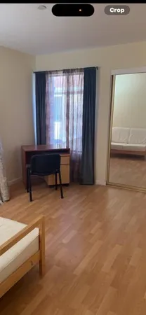 a bed room with a bed and a window