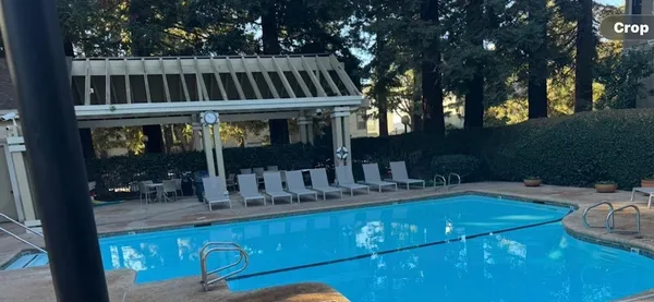 a front view of a house with garden and patio