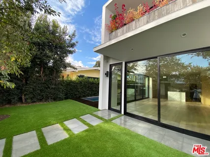 a view of a porch with a yard