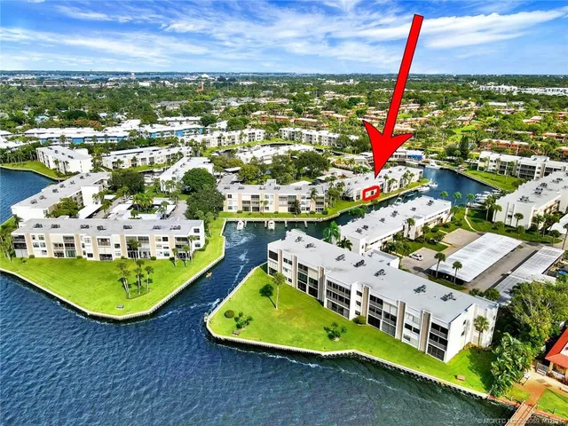 an aerial view of a house with a ocean view