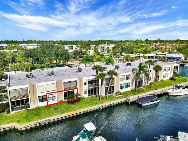 an aerial view of residential building with outdoor space ocean view