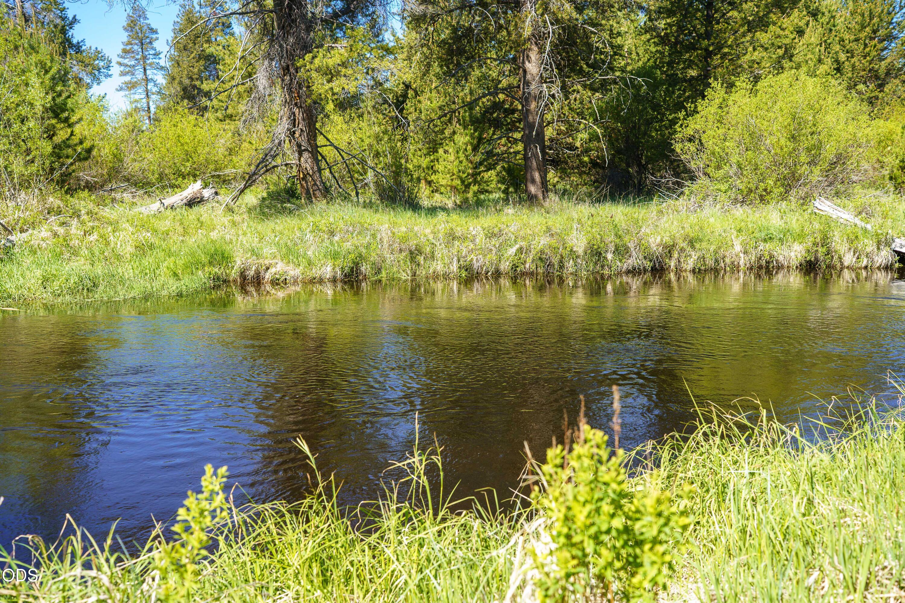 50910 Masten Road La Pine, OR 97739 - Photo 42 of 44 a view of a lake with a yard