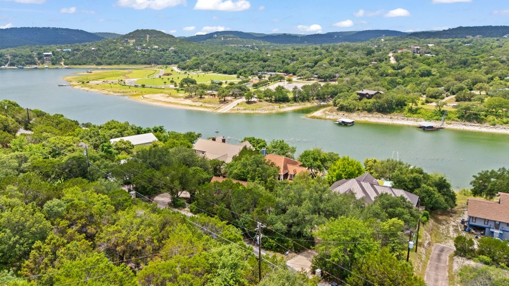 10800 Beach Road Leander, TX 78641 - Photo 34 of 39 Elevated views showcase the expansive lake and surrounding verdant hills, offering a serene waterside lifestyle.