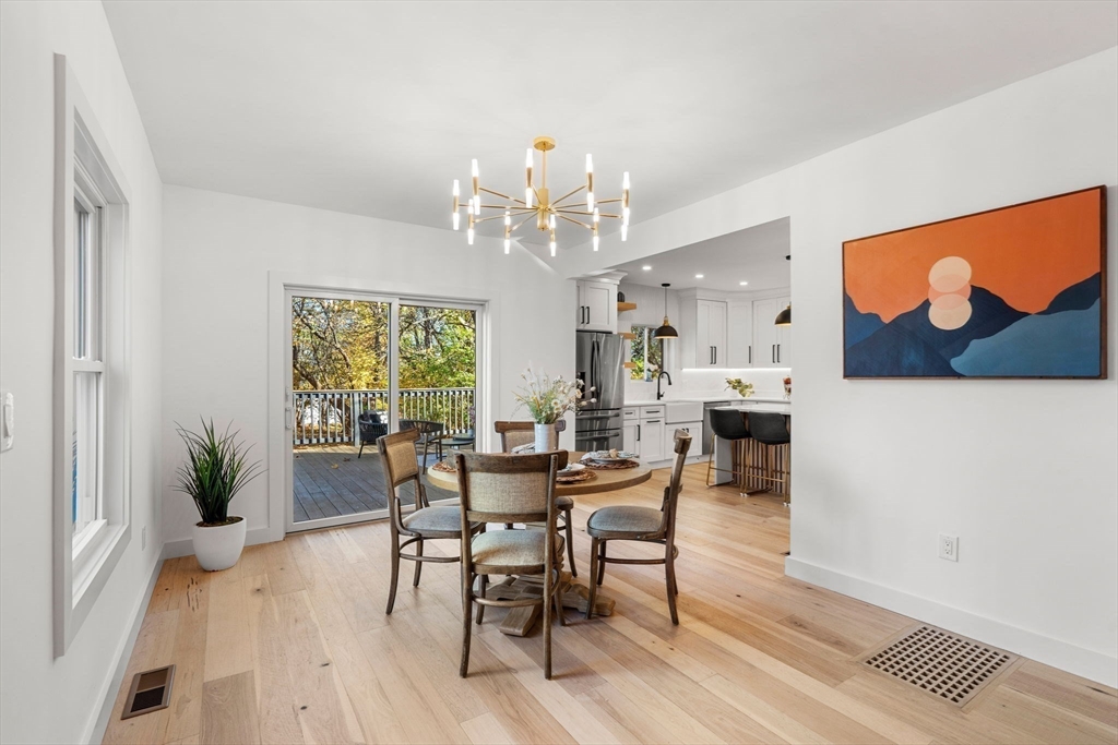 45 Charles Street Wakefield, MA 01880 - Photo 13 of 42 a view of a dining room with furniture and a chandelier