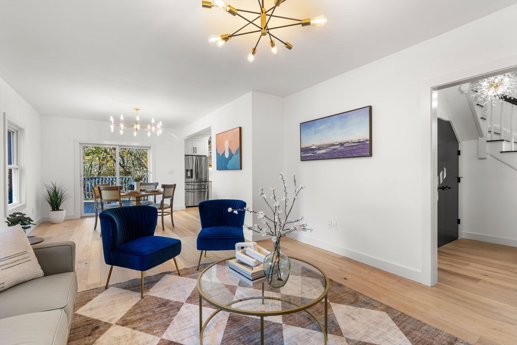 45 Charles Street Wakefield, MA 01880 - Photo 16 of 42 a living room with furniture and a large window