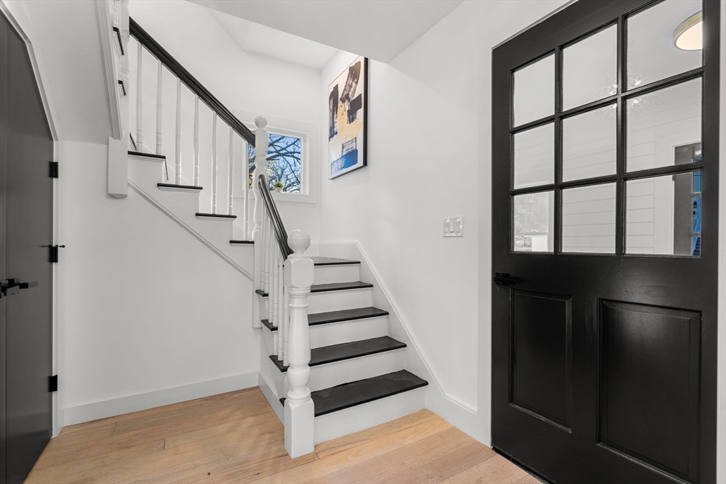 45 Charles Street Wakefield, MA 01880 - Photo 22 of 42 a view of entryway and hall with wooden floor