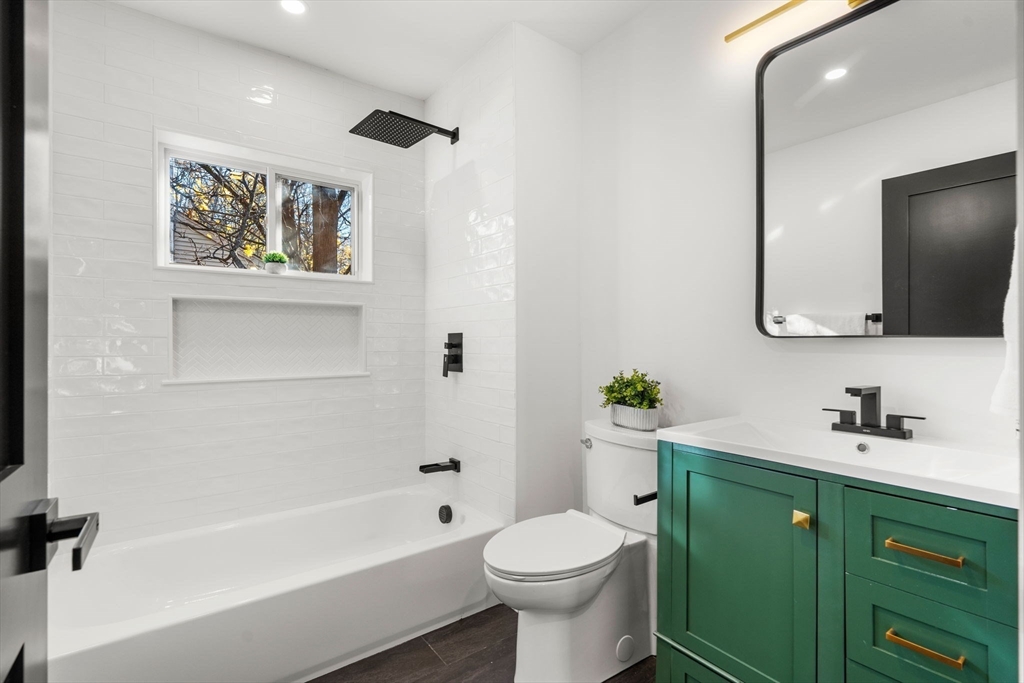 45 Charles Street Wakefield, MA 01880 - Photo 24 of 42 a bathroom with a sink mirror toilet and bathtub