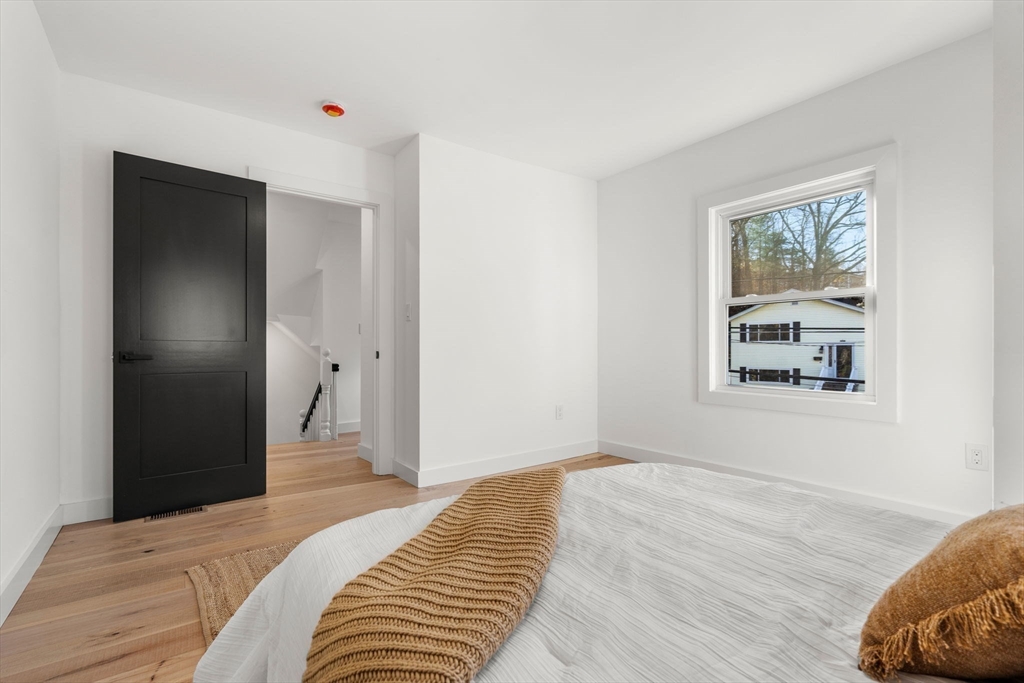 45 Charles Street Wakefield, MA 01880 - Photo 25 of 42 a bedroom with a bed and a window