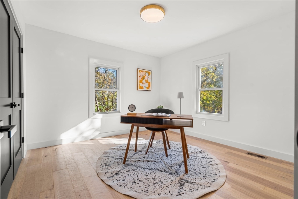 45 Charles Street Wakefield, MA 01880 - Photo 29 of 42 a workspace with furniture and a window