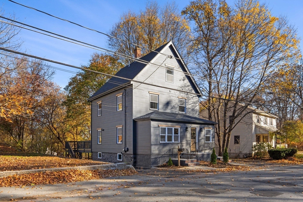 45 Charles Street Wakefield, MA 01880 - Photo 3 of 42 a front view of a house with a yard