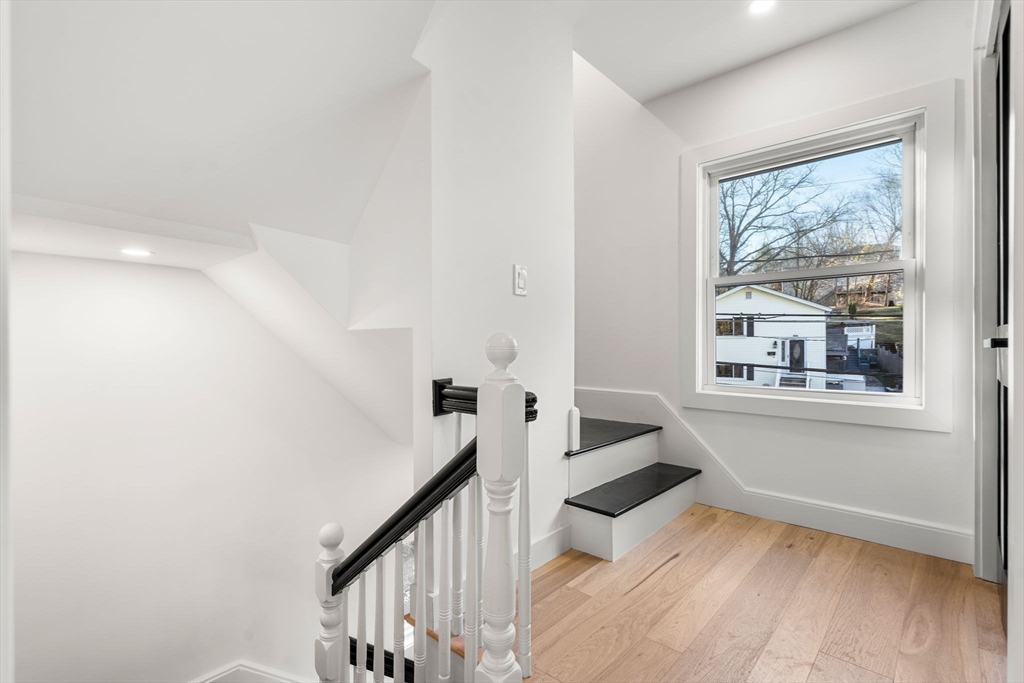 45 Charles Street Wakefield, MA 01880 - Photo 31 of 42 a view of entryway with wooden floor and stairs