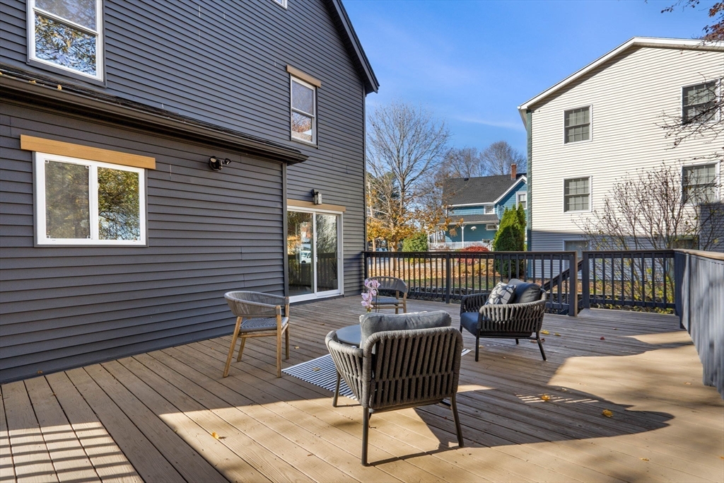 45 Charles Street Wakefield, MA 01880 - Photo 40 of 42 a view of a patio with couches chairs and wooden floor