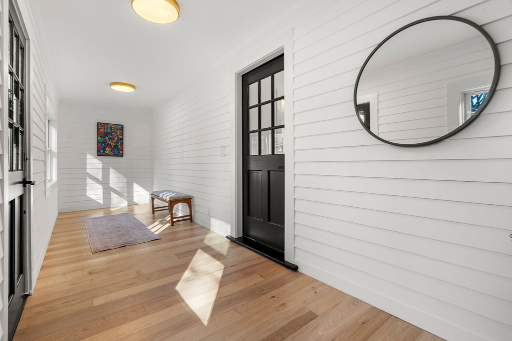 45 Charles Street Wakefield, MA 01880 - Photo 4 of 42 a view of a livingroom with furniture and wooden floor