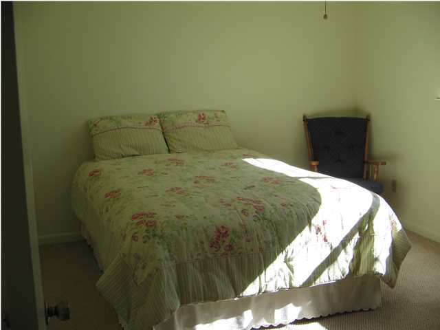 447 Paul Road DeFuniak Springs, FL 32433 - Photo 14 of 15 a bed sitting in a bedroom next to a window