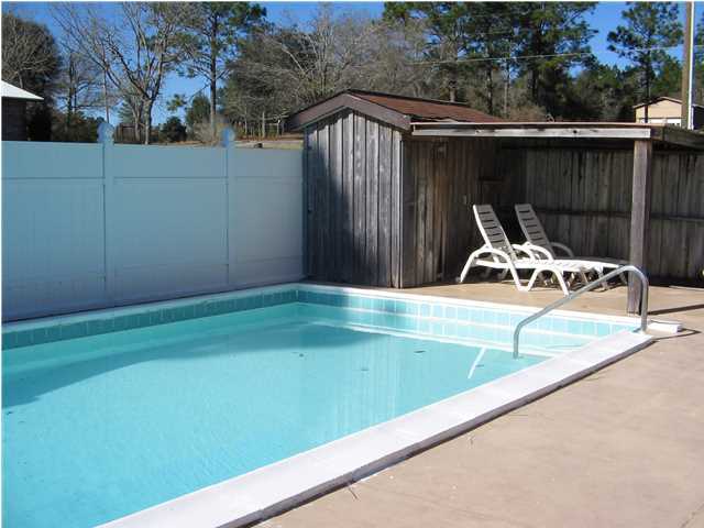 447 Paul Road DeFuniak Springs, FL 32433 - Photo 4 of 15 a view of a backyard with table and chairs