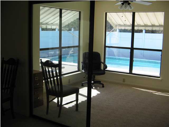 447 Paul Road DeFuniak Springs, FL 32433 - Photo 10 of 15 a view of a dining room with furniture window and outside view