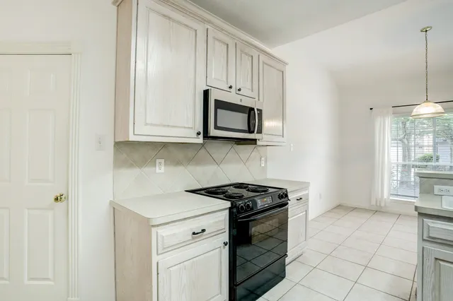 a view of an empty room with windows