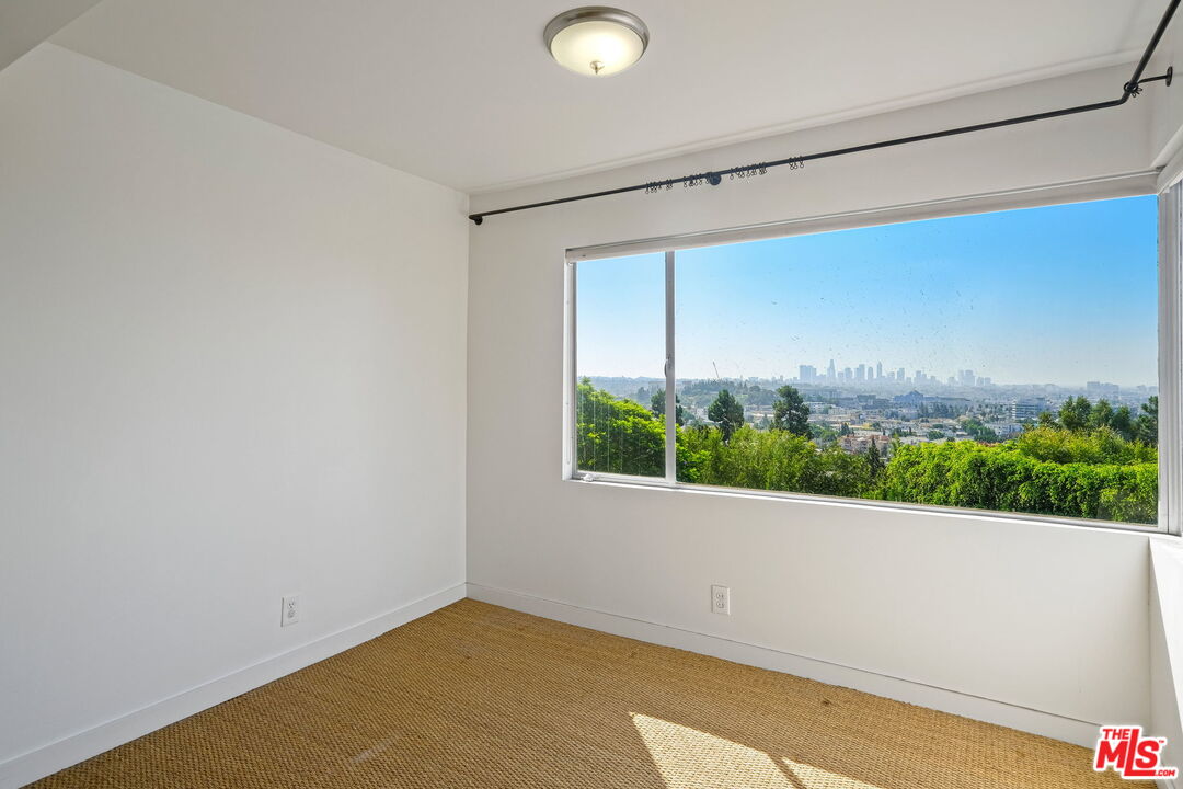 1968 Cummings Drive Los Angeles, CA 90027 - Photo 16 of 26 a view of a room with wooden floor and window