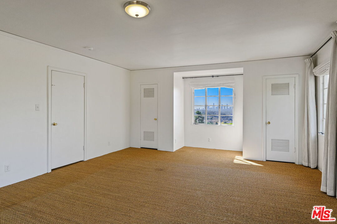 1968 Cummings Drive Los Angeles, CA 90027 - Photo 18 of 26 a view of an empty room and window