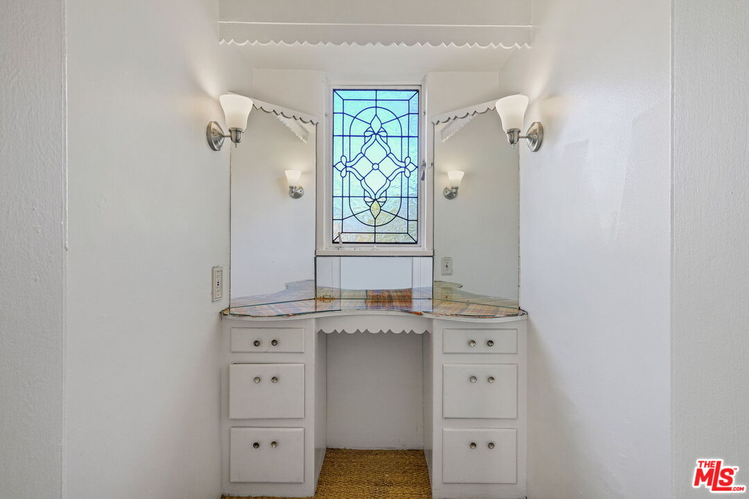 1968 Cummings Drive Los Angeles, CA 90027 - Photo 19 of 26 a bathroom with a granite countertop sink mirror and window