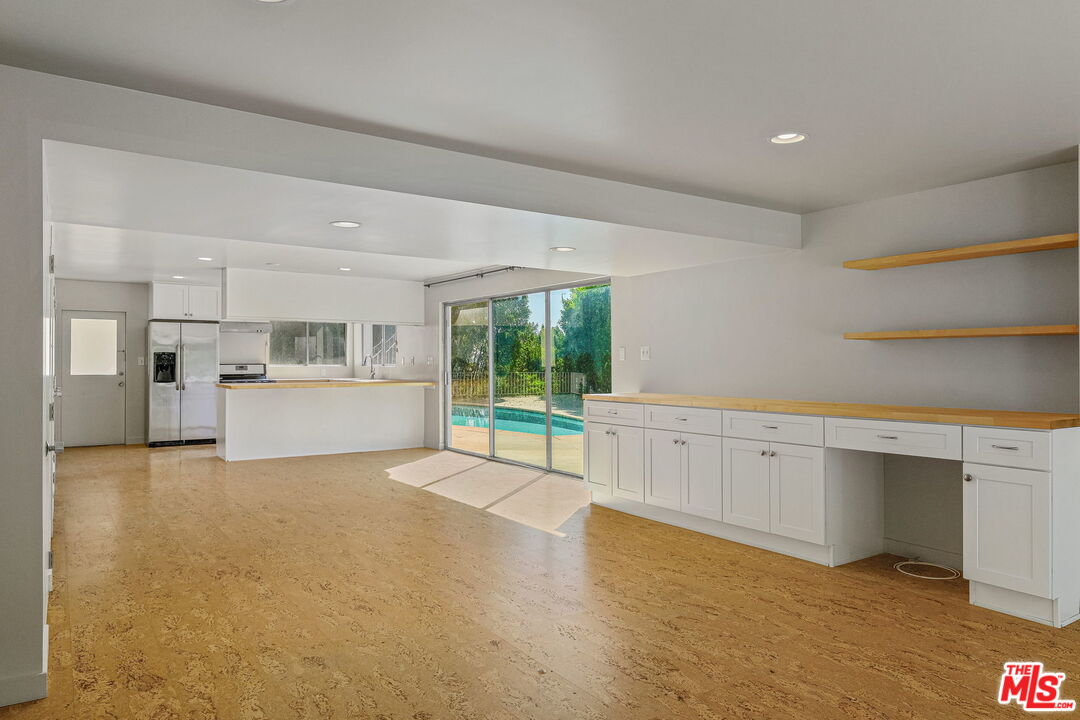 1968 Cummings Drive Los Angeles, CA 90027 - Photo 22 of 26 a view of a kitchen with wooden floor and electronic appliances
