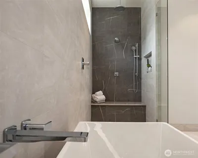 a bathroom with a bathtub and sink
